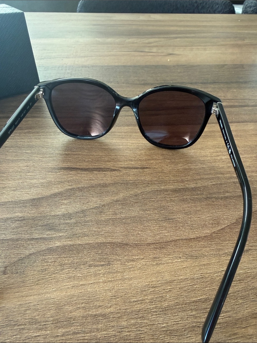 Prada Woman’s Black Frame Sunglasses with Dark Lenses - Picture 3 of 4